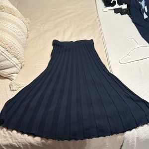 Pleated knit midi skirt.